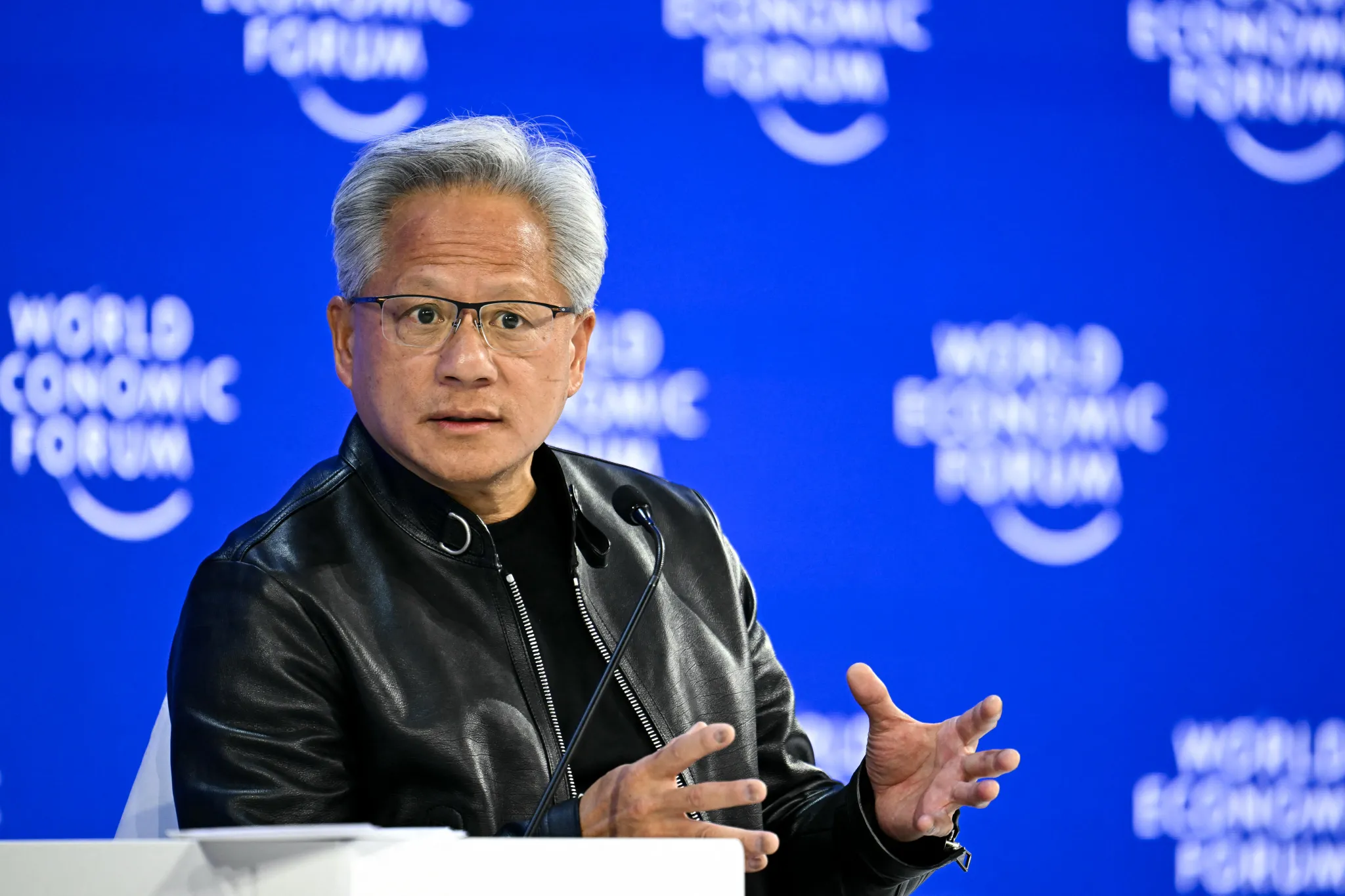 Tech CEOs boast and bicker about AI at Davos